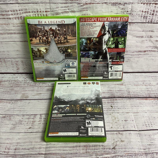 Microsoft Xbox 360 3 pc. Game Bundle (AC Brotherhood Batman Arkham City Skyrim)