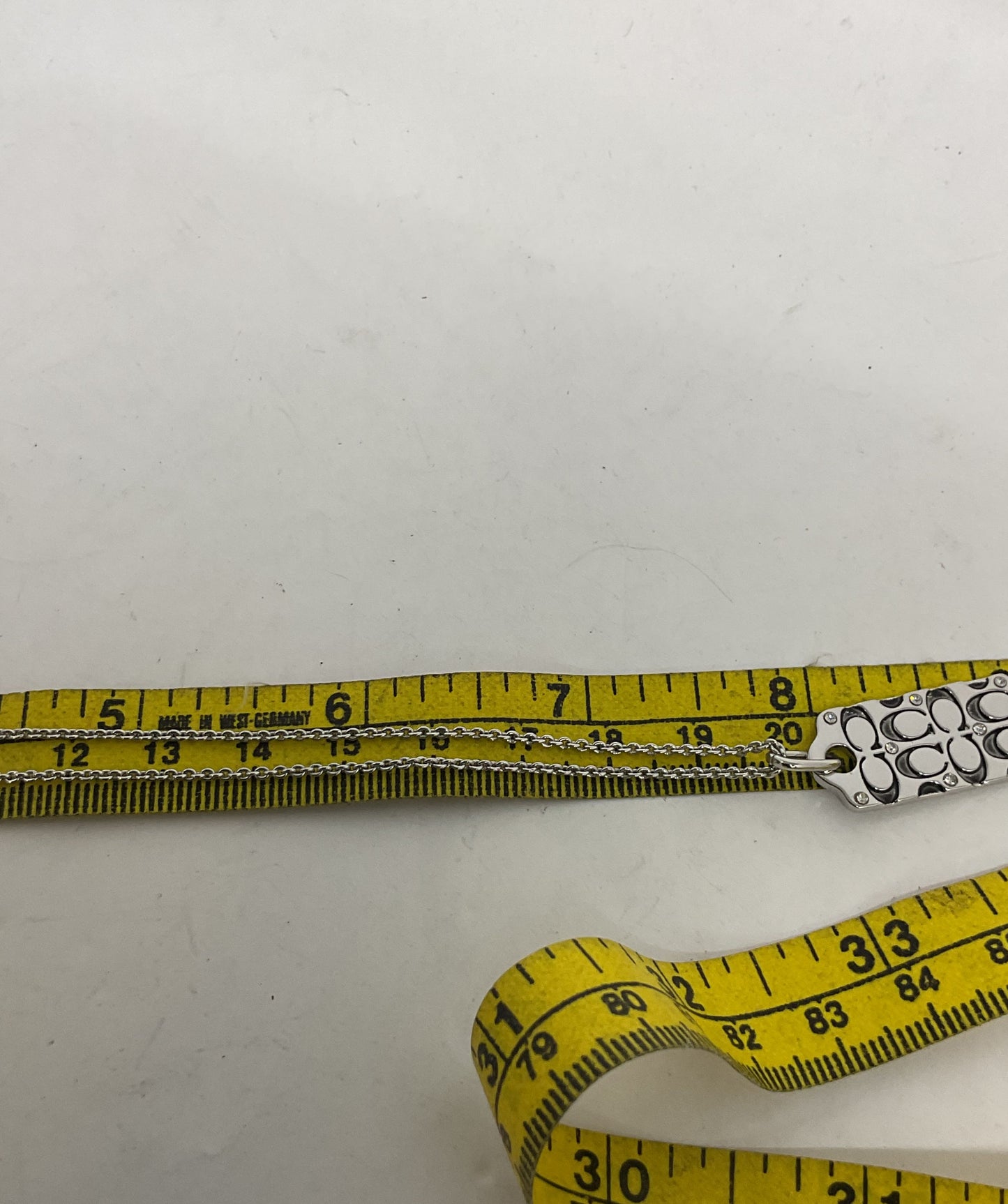 Coach Silver Tone Logo Pendant Necklace