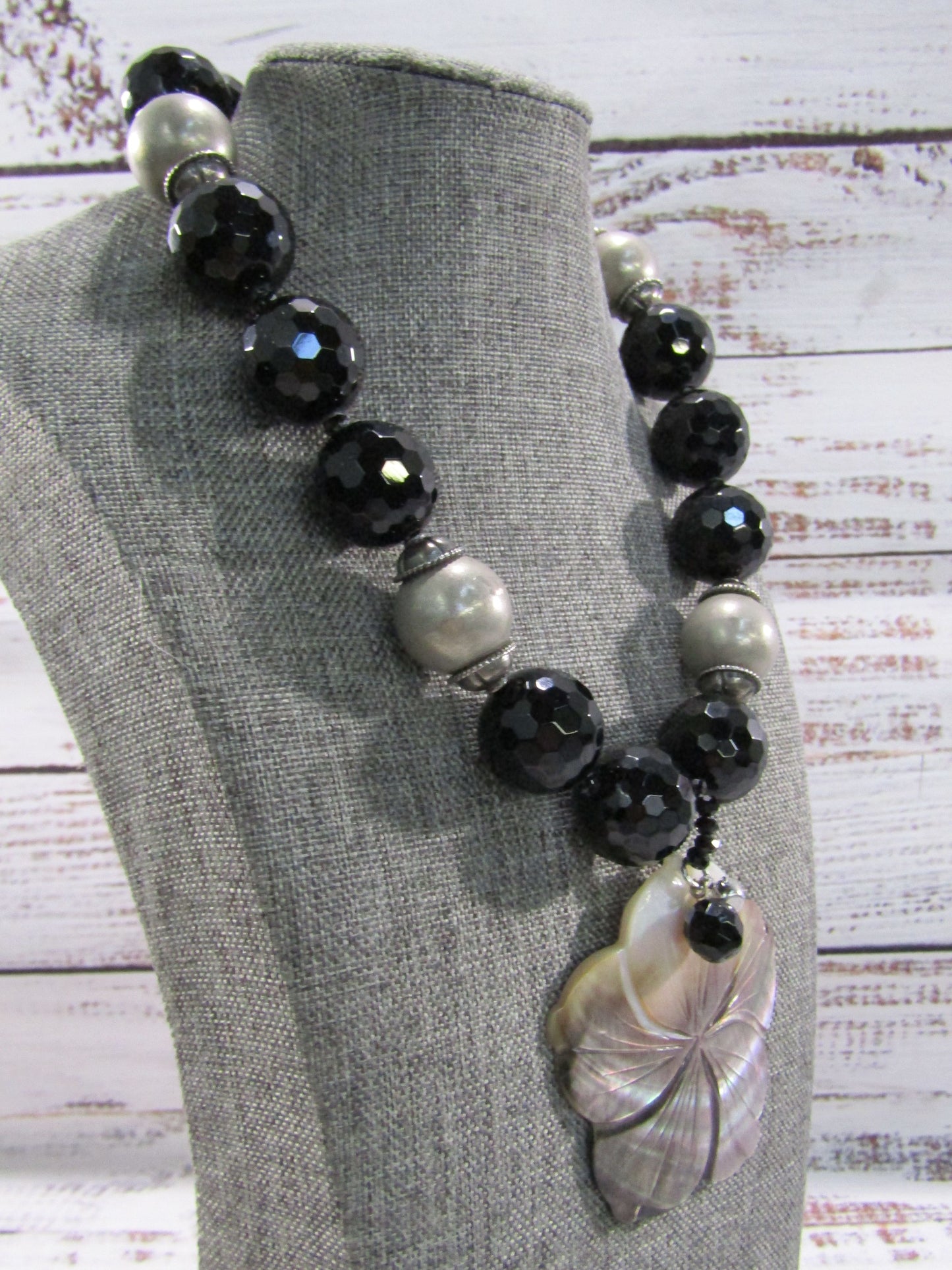 Faceted Onyx Beaded Necklace With Floral Carved Mother of Pearl Pendant