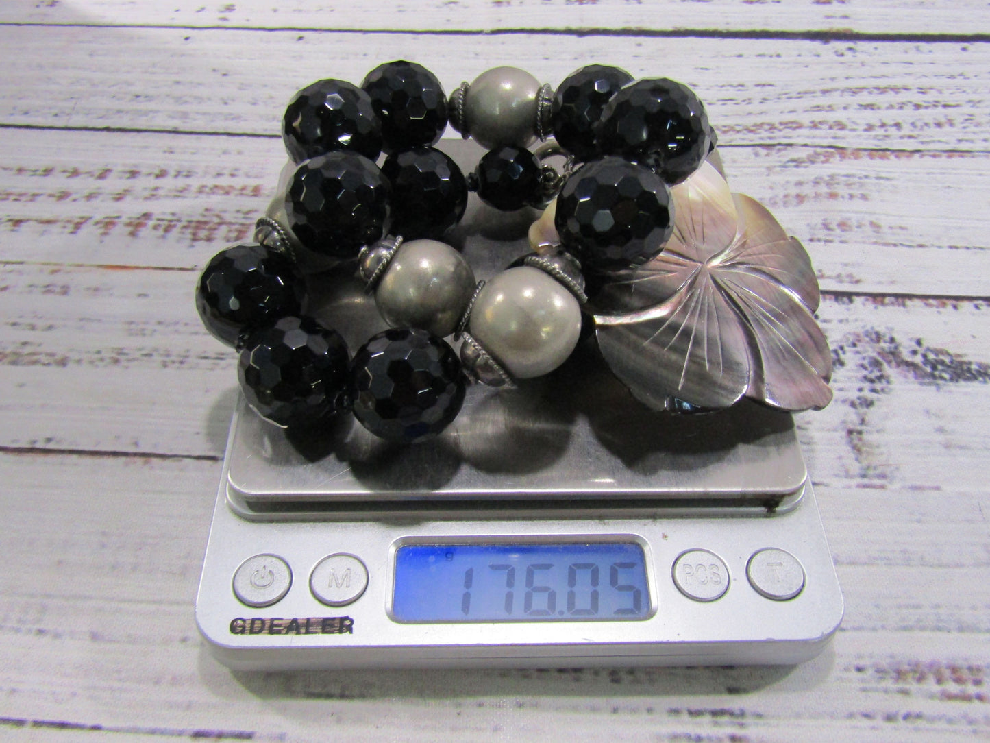 Faceted Onyx Beaded Necklace With Floral Carved Mother of Pearl Pendant
