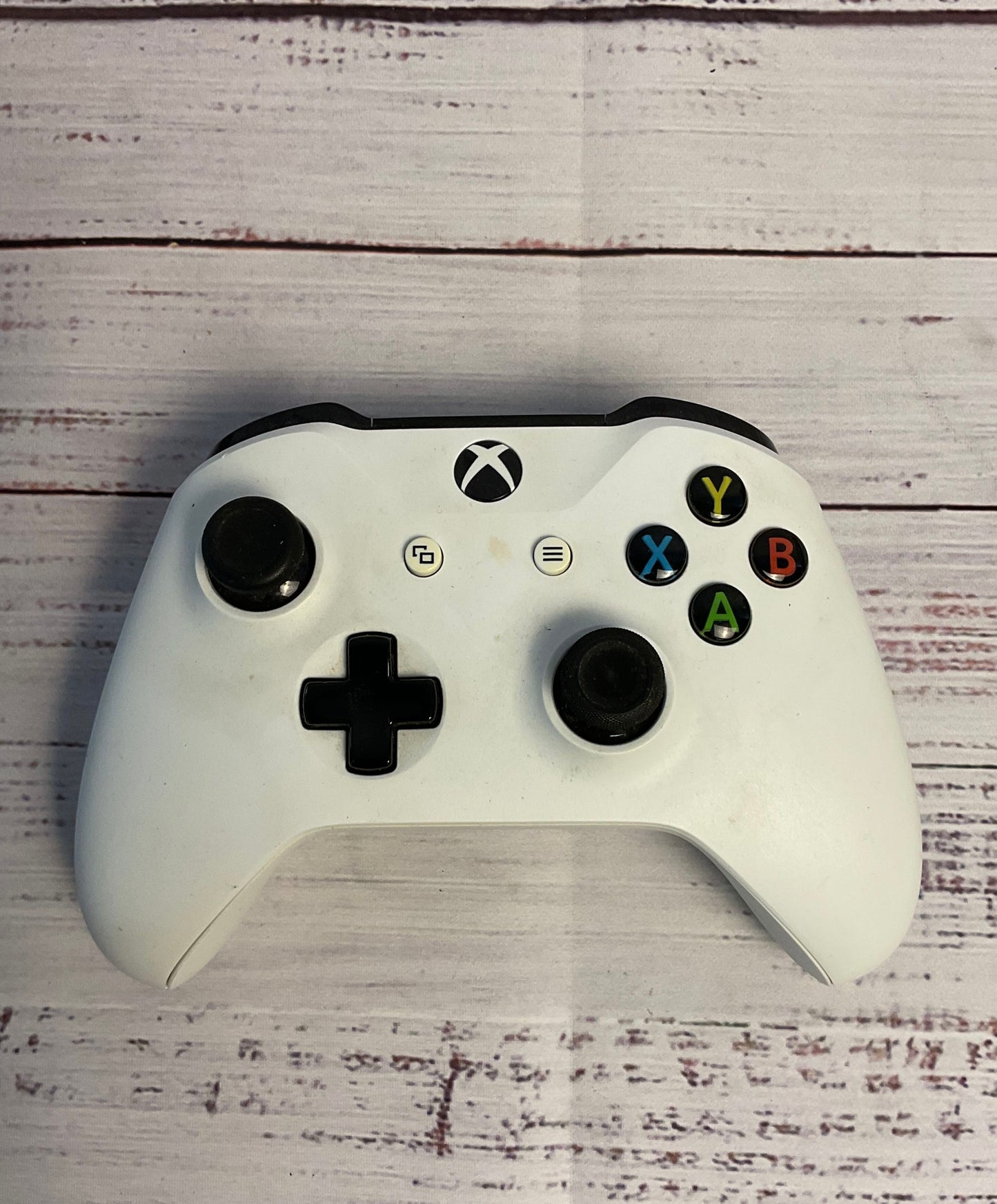 Two Black and White Microsoft Xbox Wireless Controllers