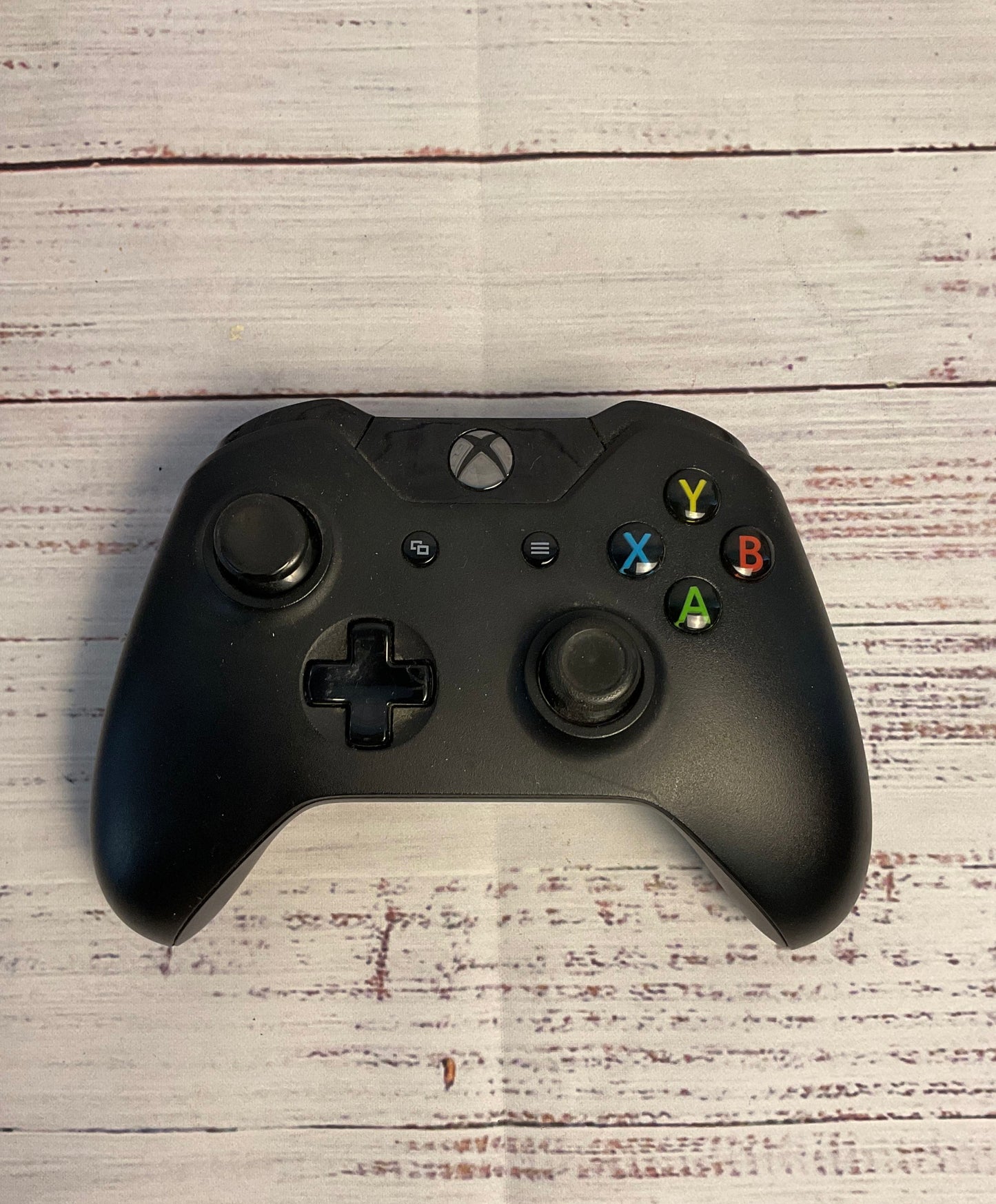 Two Black and White Microsoft Xbox Wireless Controllers
