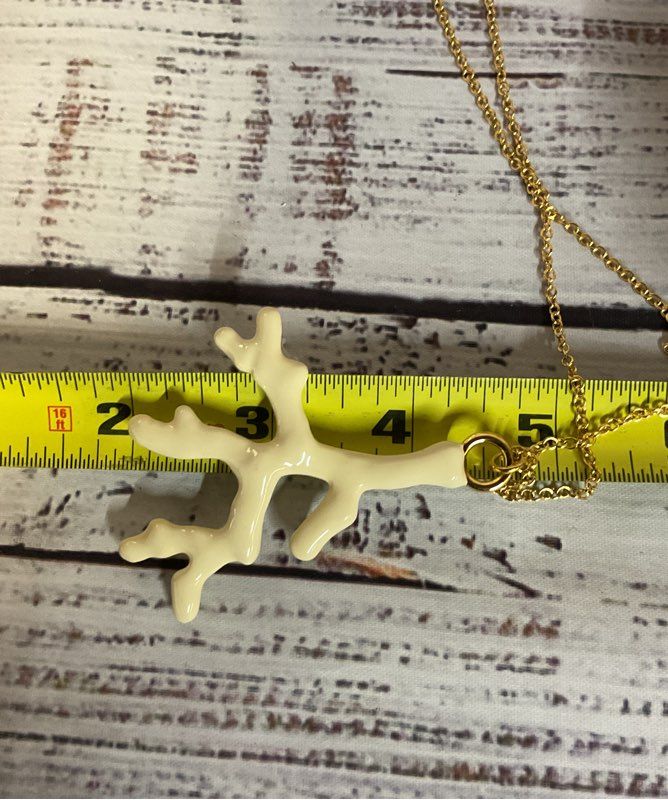 Trina Turk Gold Tone Long Chain Necklace with White Coral Shape Pendant