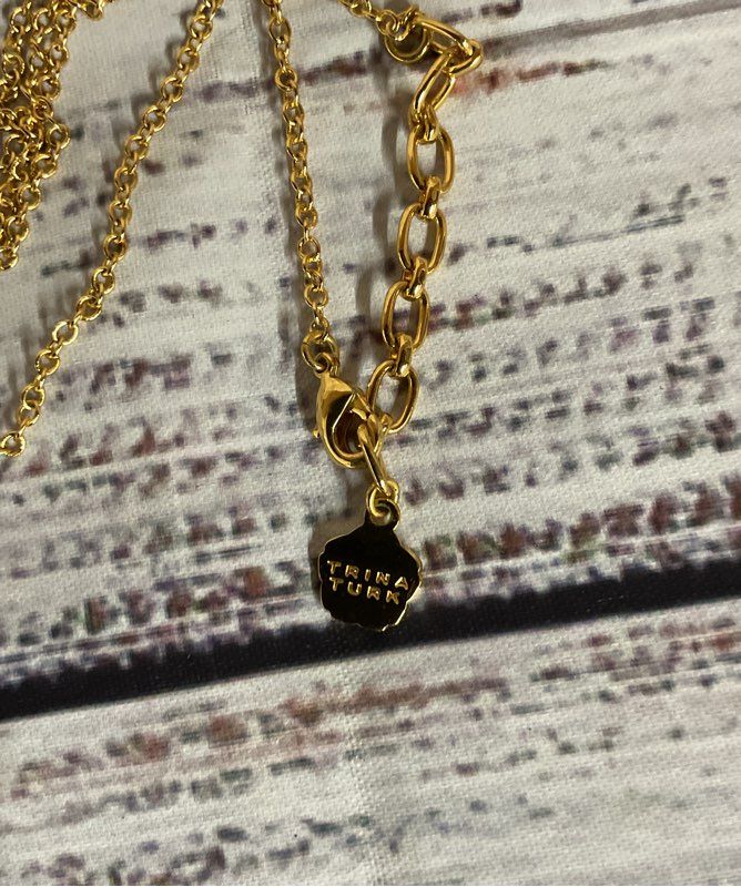 Trina Turk Gold Tone Long Chain Necklace with White Coral Shape Pendant