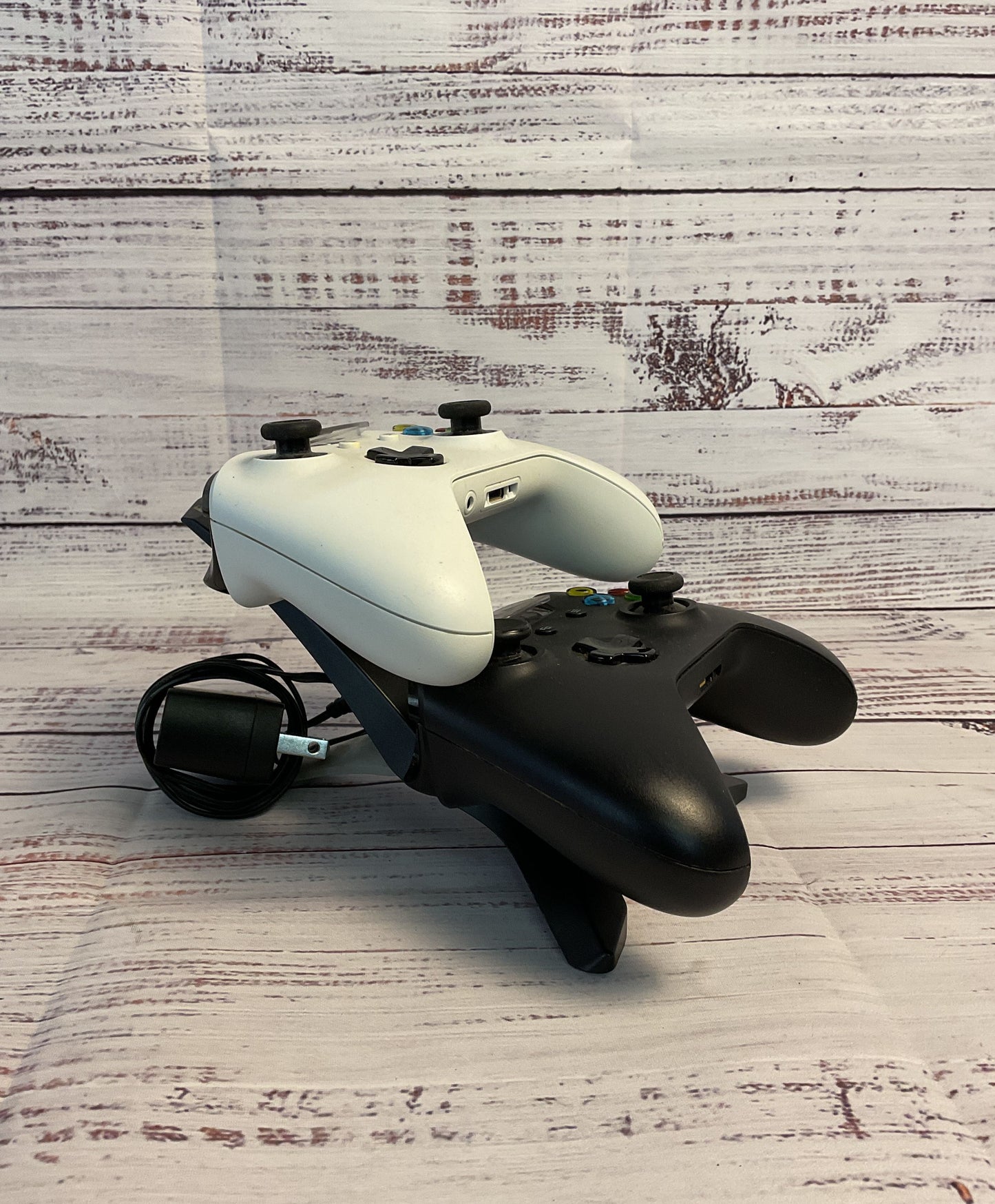 Two Black and White Microsoft Xbox Wireless Controllers