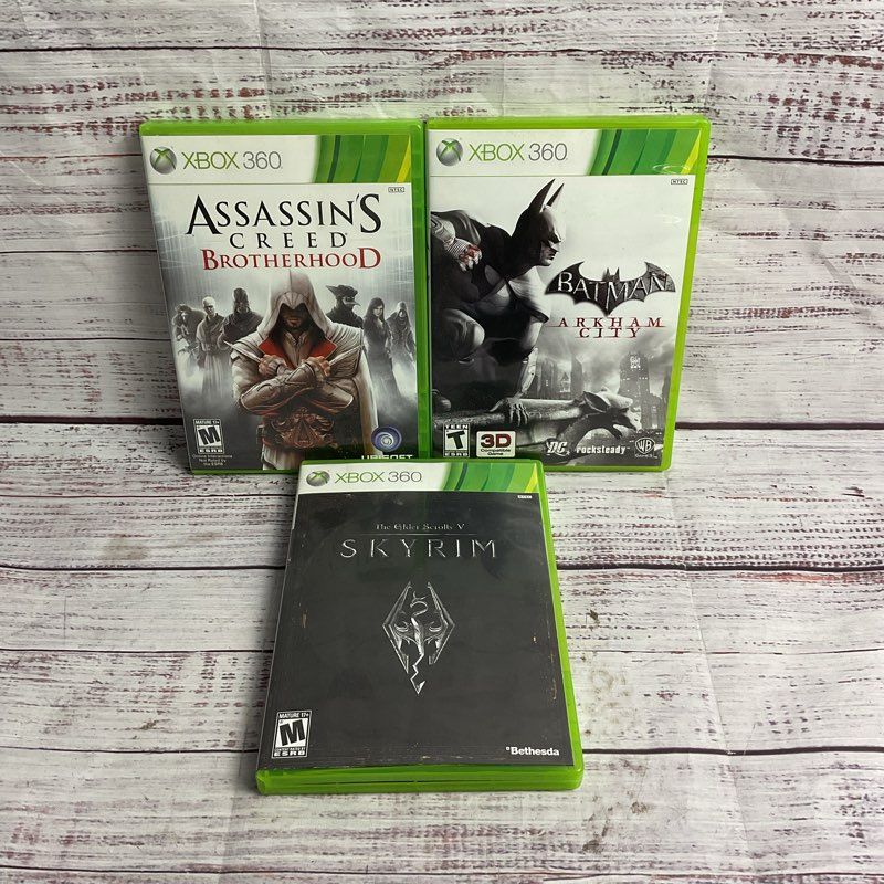 Microsoft Xbox 360 3 pc. Game Bundle (AC Brotherhood Batman Arkham City Skyrim)