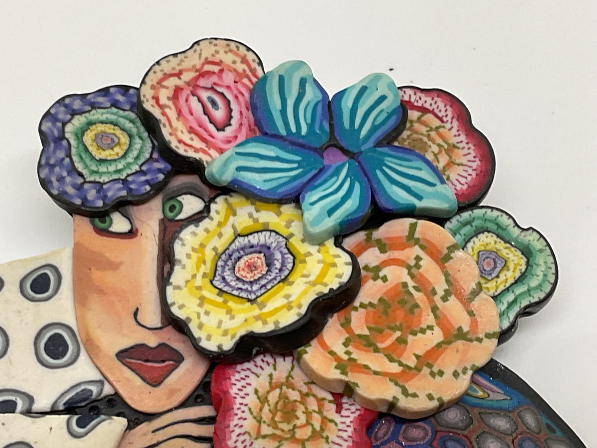 VTG. GG Artisan Woman with Floral Headpiece Rubber Brooch- 2.75"