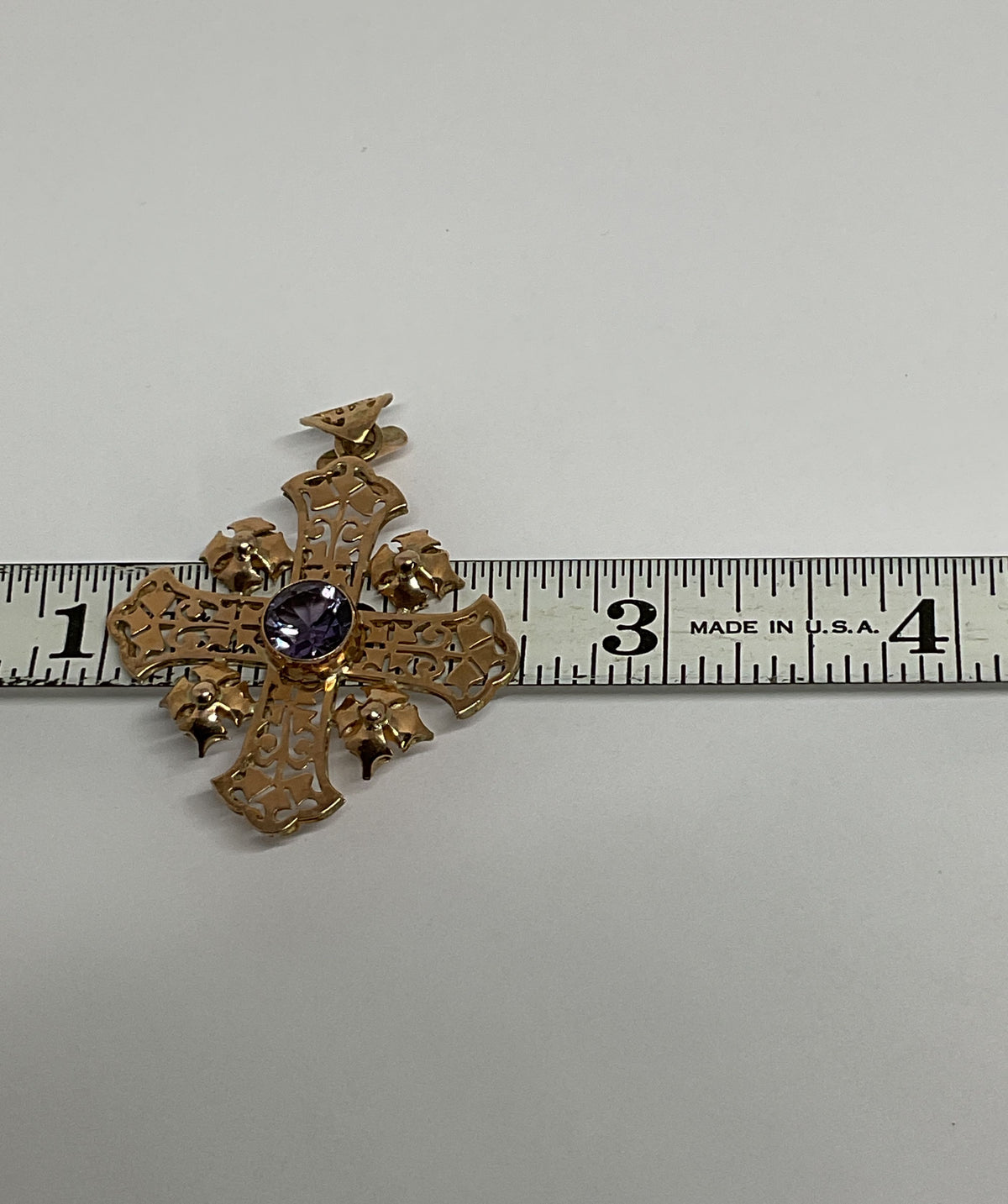 Ornate 14K Yellow Gold Cross Pendant with Purple Sapphire