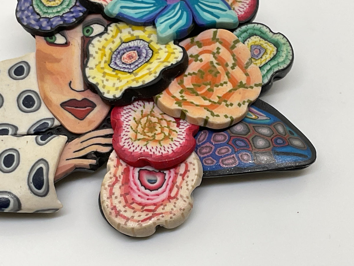 VTG. GG Artisan Woman with Floral Headpiece Rubber Brooch- 2.75"