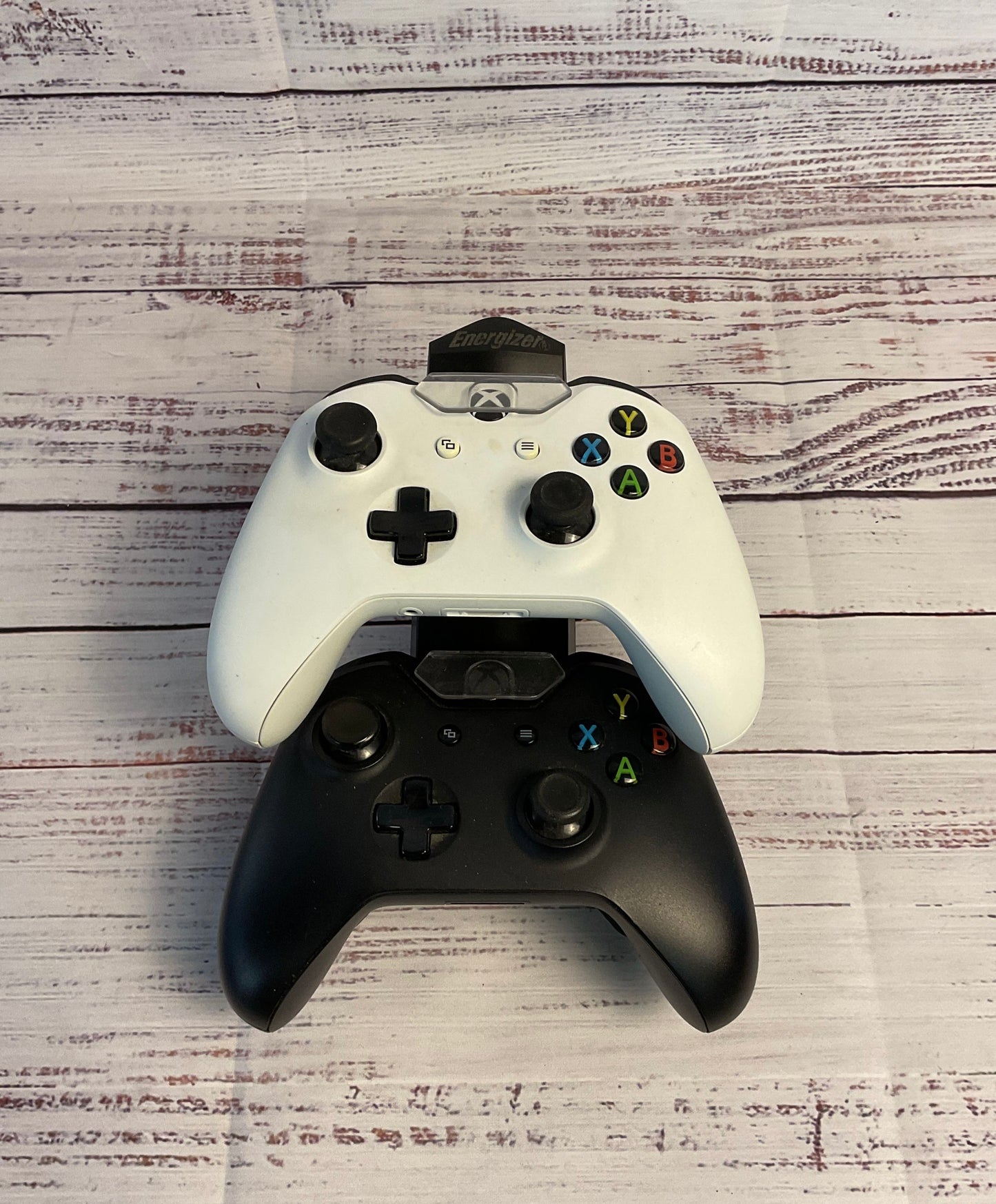 Two Black and White Microsoft Xbox Wireless Controllers