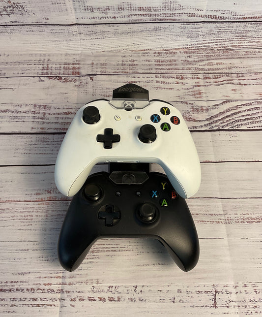 Two Black and White Microsoft Xbox Wireless Controllers