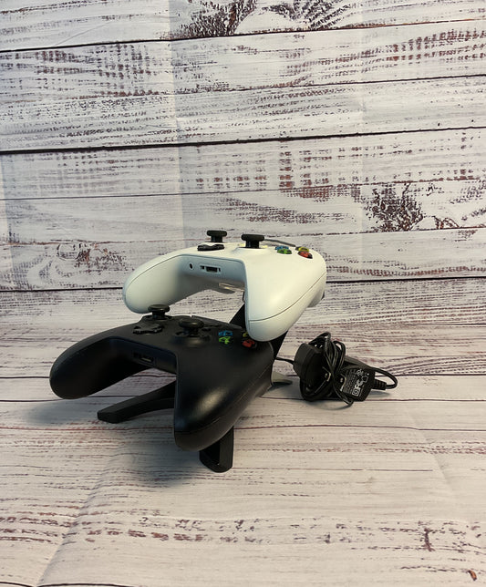 Two Black and White Microsoft Xbox Wireless Controllers