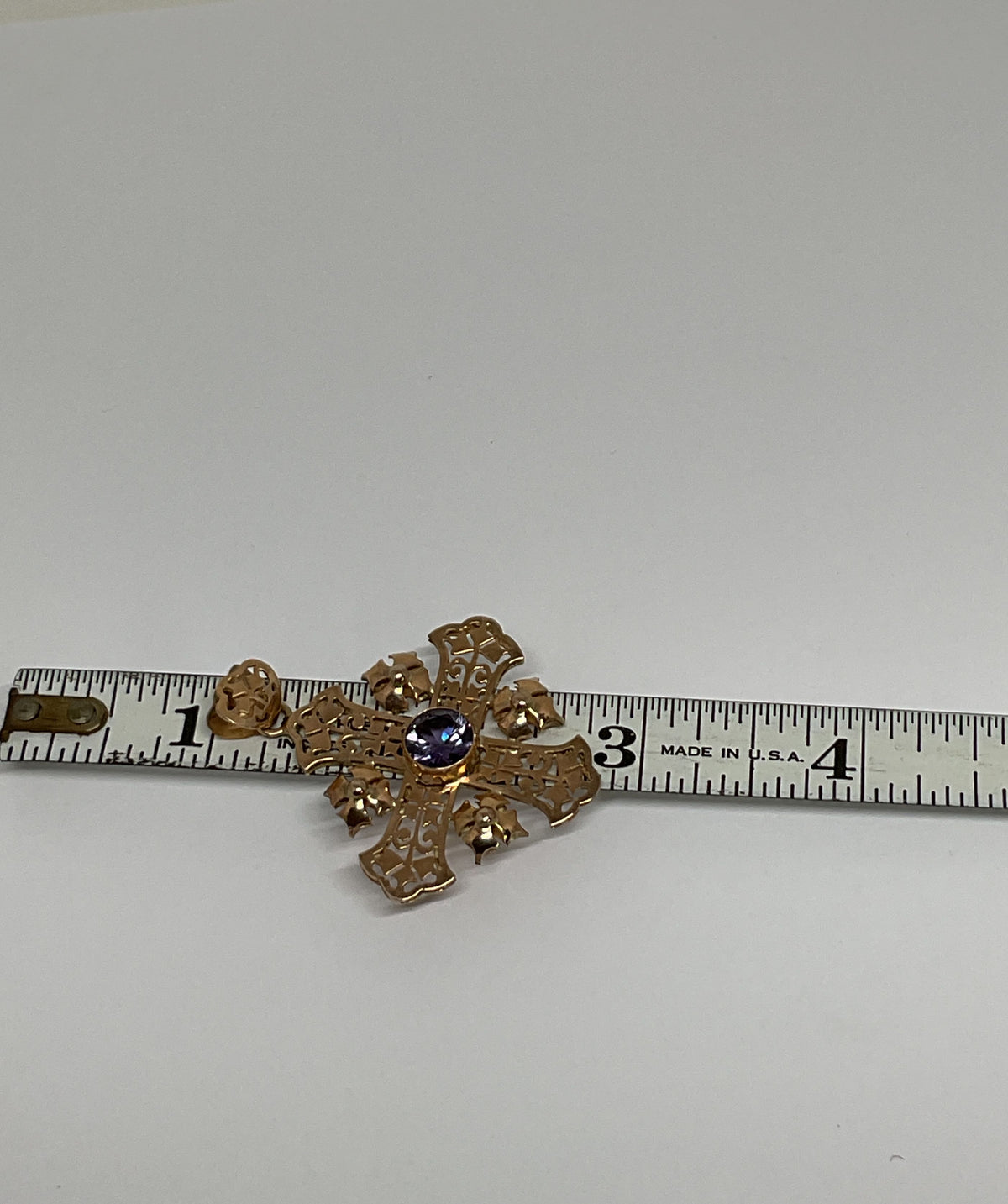 Ornate 14K Yellow Gold Cross Pendant with Purple Sapphire