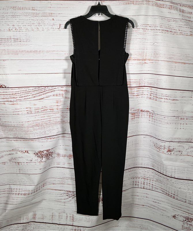 NWT Taylor Black Sleeveless Jumpsuit with bib overlay front Size 6