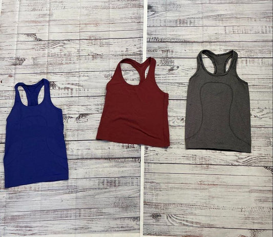 Women's Lot of 7 Lululemon Tops, Leggings, and Bicycle short Assorted Sizes