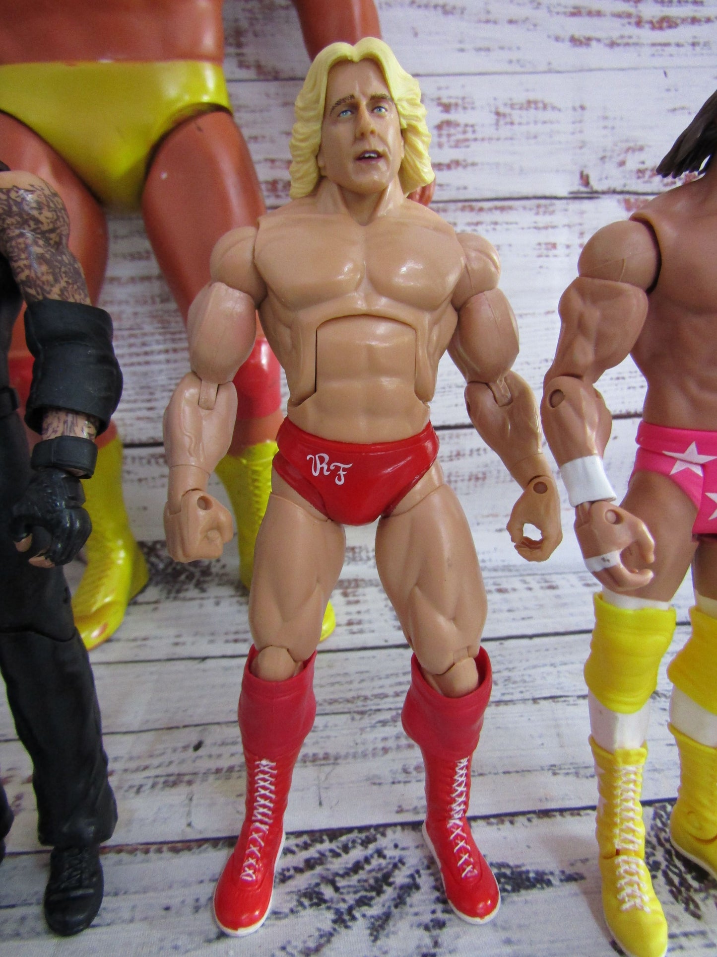 Lot of 6 WWE Action Figures Undertaker Bobby Lashley Macho Man Ultimate Warrior