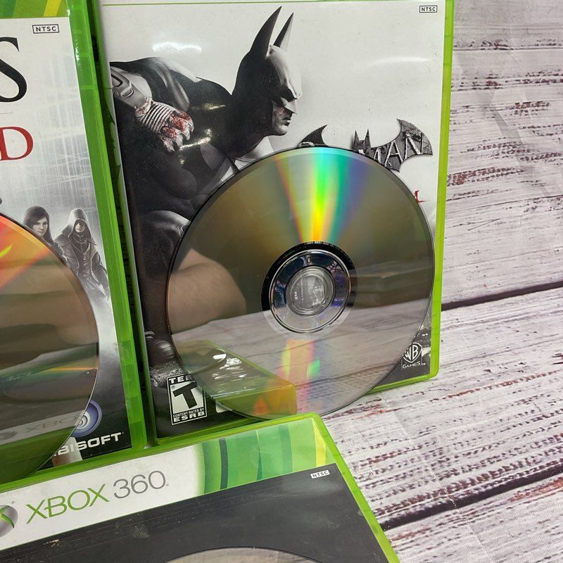 Microsoft Xbox 360 3 pc. Game Bundle (AC Brotherhood Batman Arkham City Skyrim)