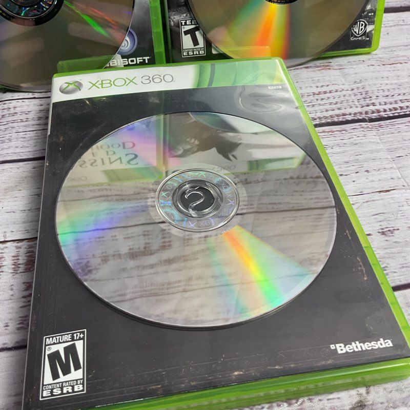 Microsoft Xbox 360 3 pc. Game Bundle (AC Brotherhood Batman Arkham City Skyrim)