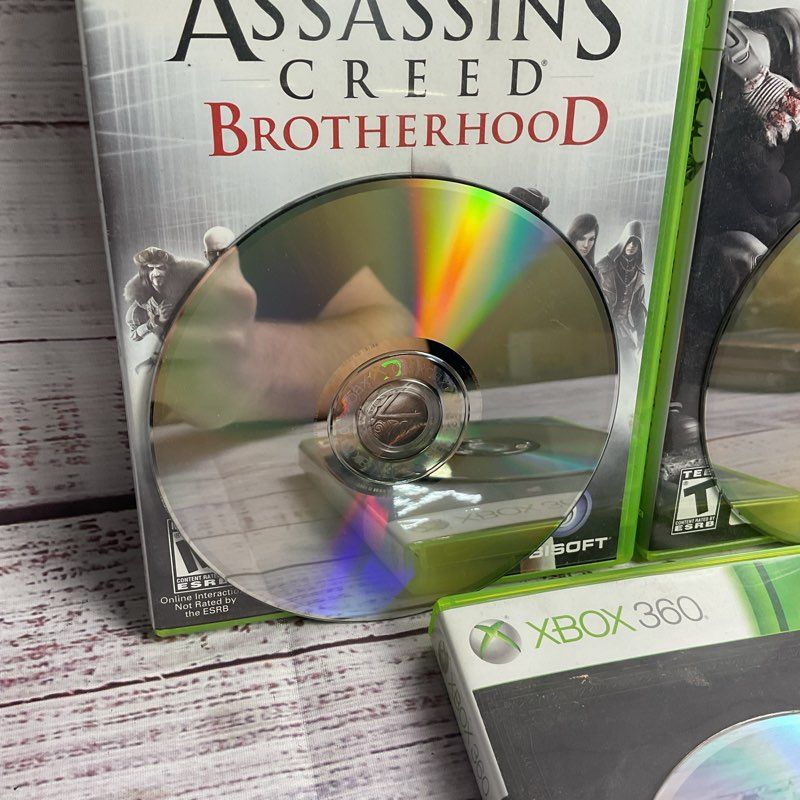 Microsoft Xbox 360 3 pc. Game Bundle (AC Brotherhood Batman Arkham City Skyrim)