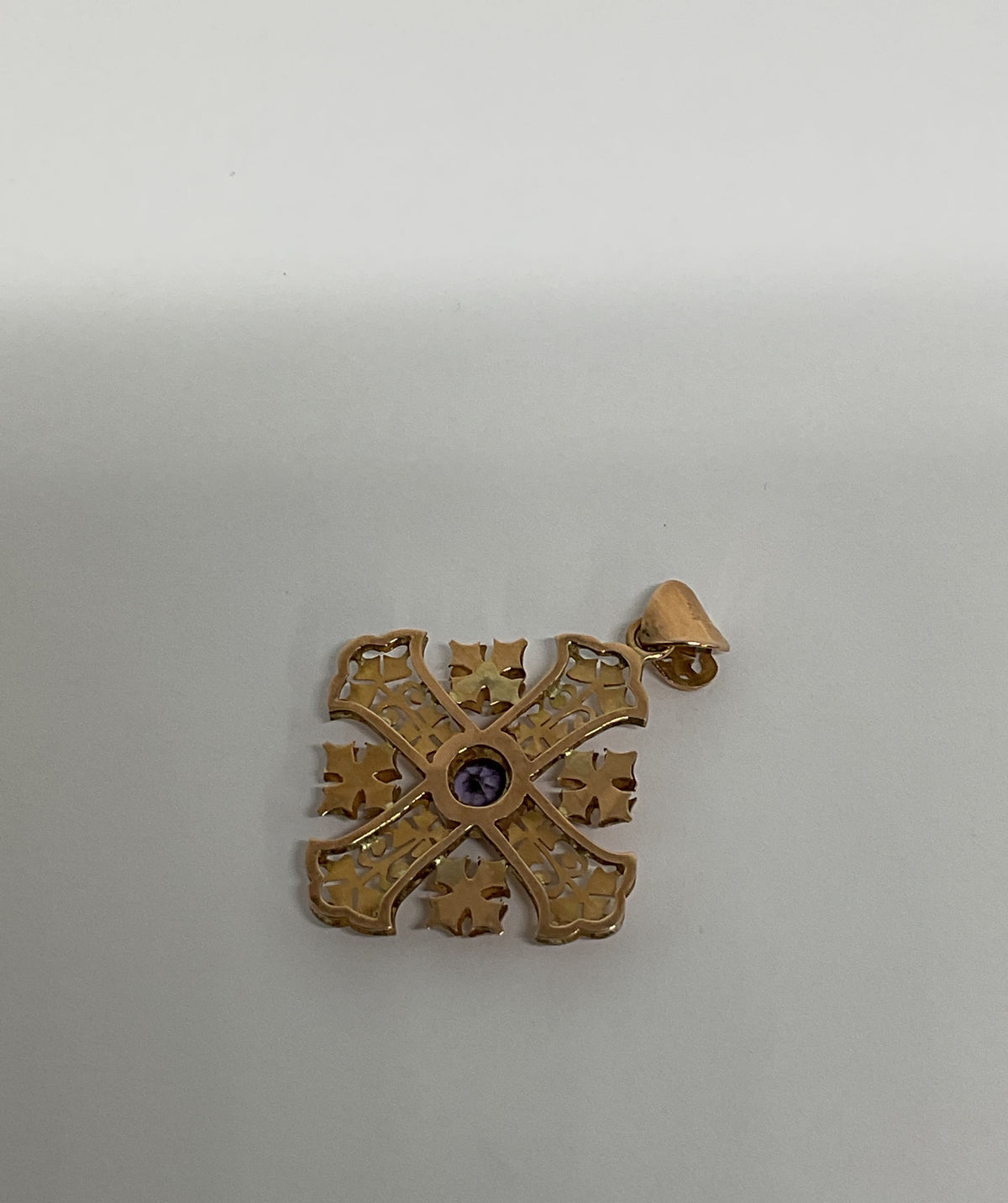 Ornate 14K Yellow Gold Cross Pendant with Purple Sapphire