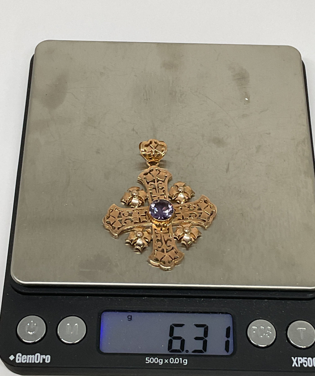 Ornate 14K Yellow Gold Cross Pendant with Purple Sapphire