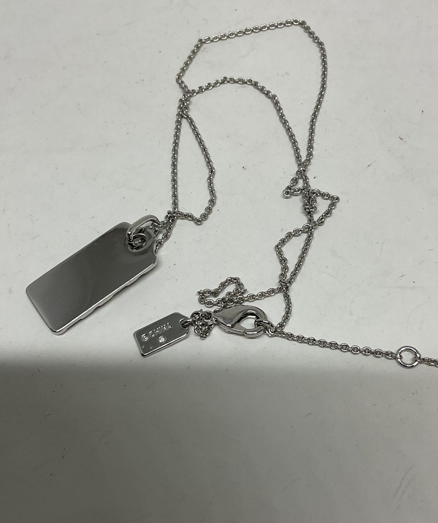 Coach Silver Tone Logo Pendant Necklace