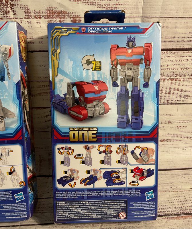 New Optimus Prime & Starscream Transformers One Action Figures Hasbro