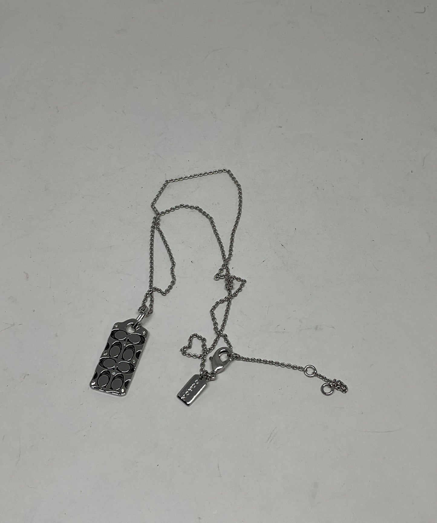 Coach Silver Tone Logo Pendant Necklace