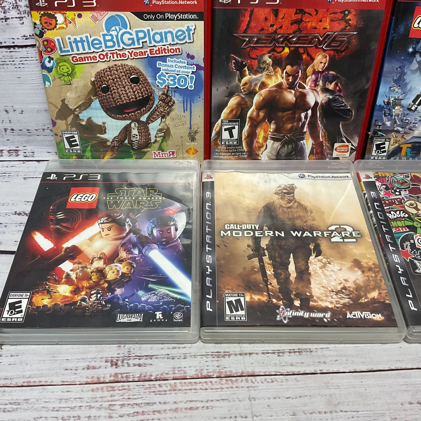 Sony Play Station 3 Mixed Games Lot COD MW2 Star Wars Little Big Planet Tekken 6